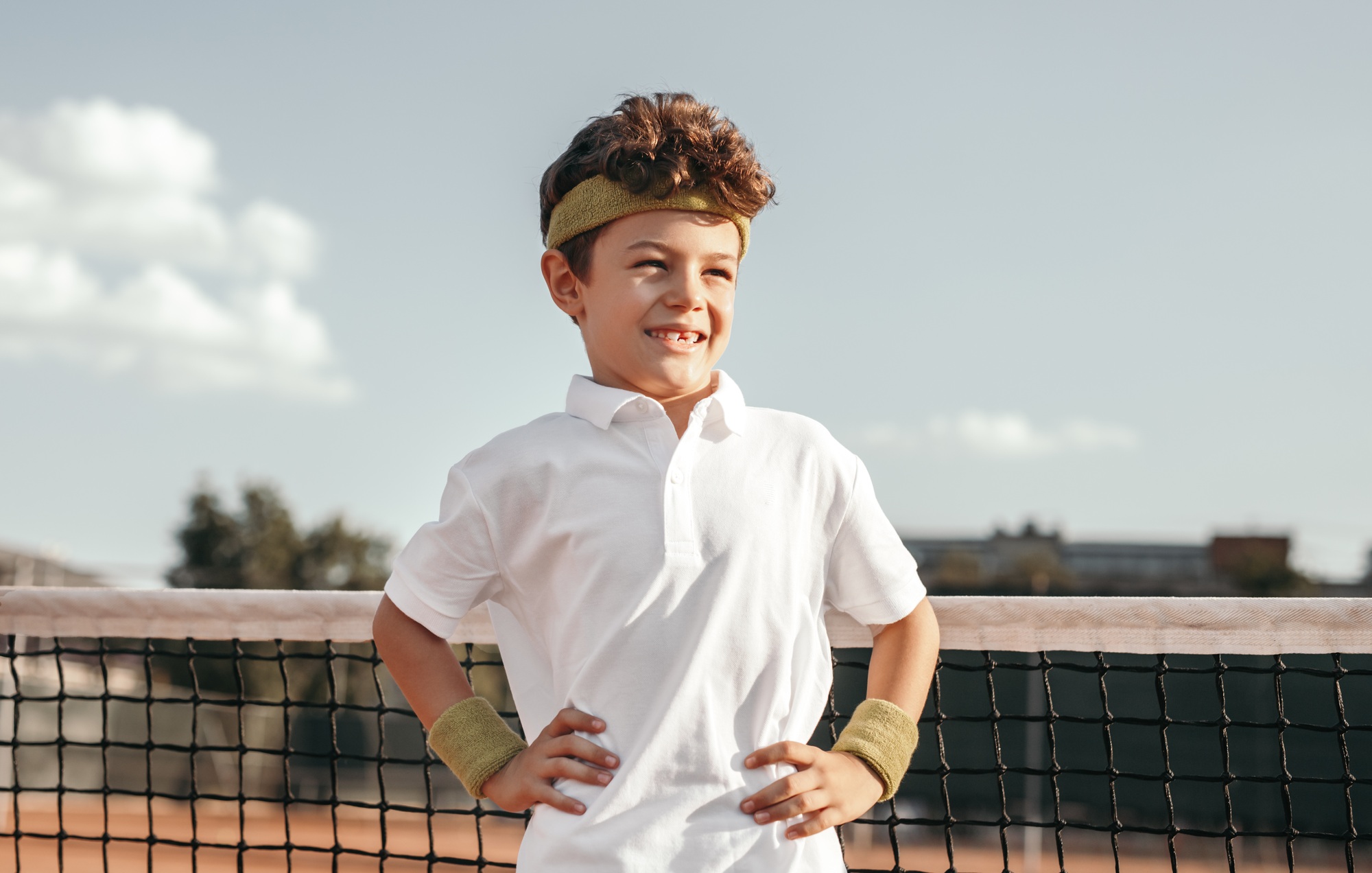 Little tennis champion on court
